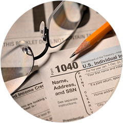 Lakeville Accountants | Form 1040 with pencil and glasses